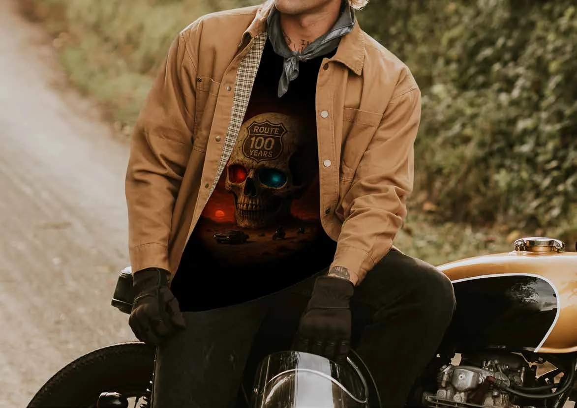 A motorcyclist in a centennial skull T-shirt