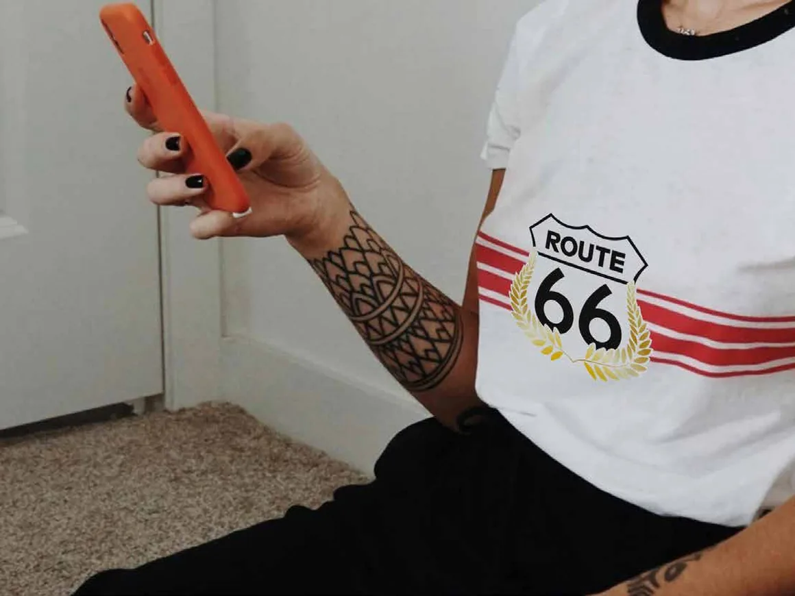 A ROUTE 66 ringer T-shirt with the centennial shield