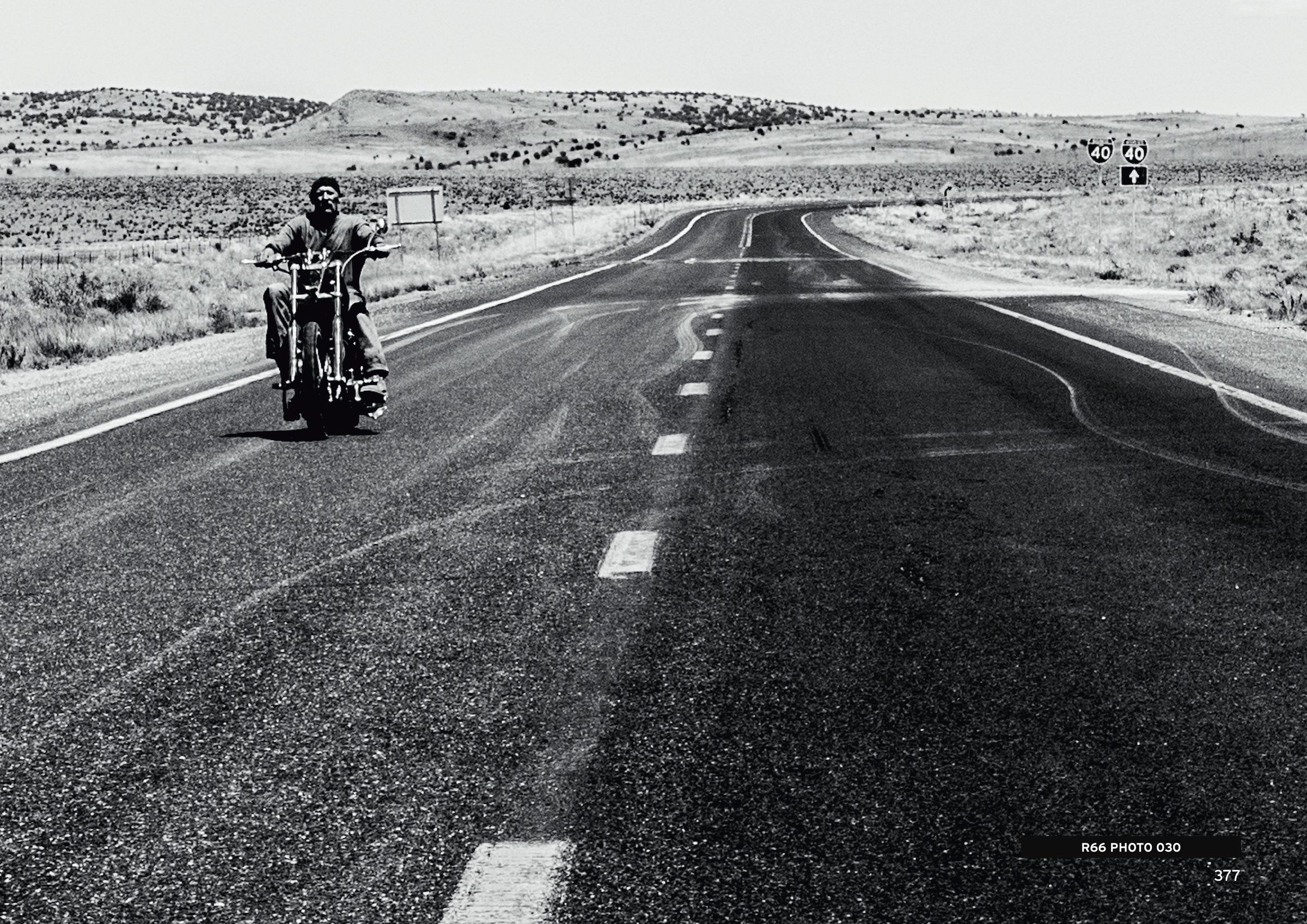 A motorcyclist on an empty stretch of ROUTE 66