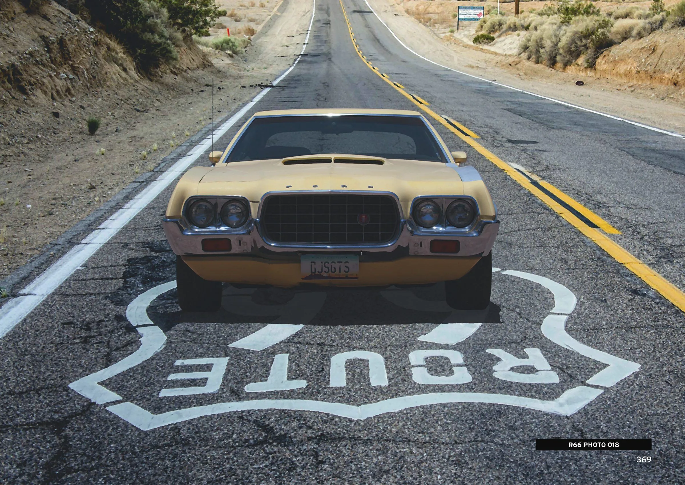 A classic car on Historic ROUTE 66 with the shield painted on the asphalt